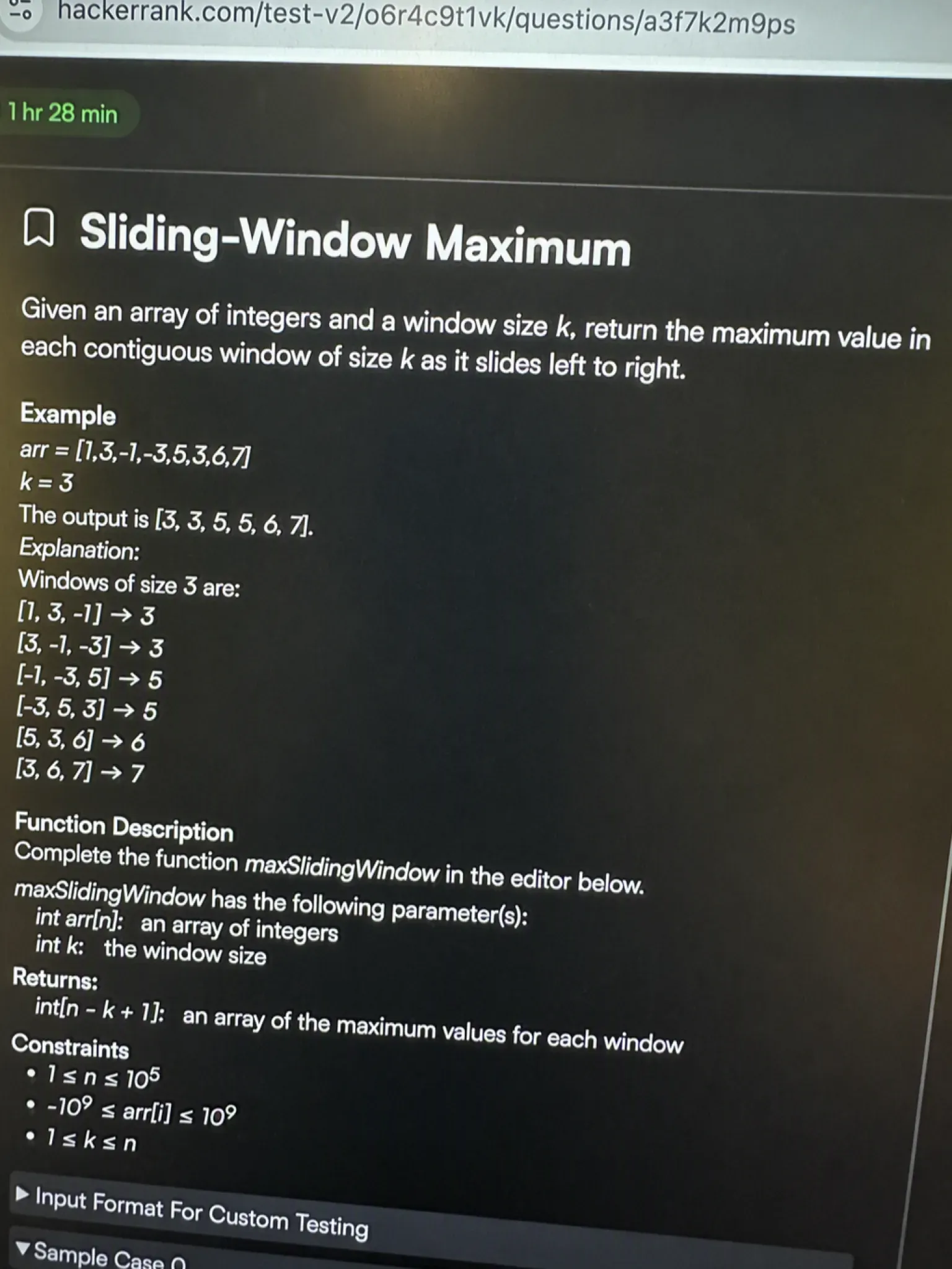 The Oracle HackerRank problem panel showing the Sliding-Window Maximum question